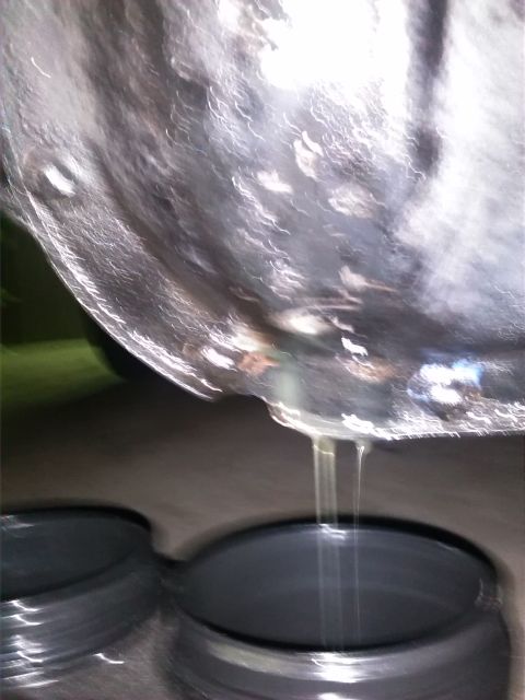 1992 Ford Bronco - Fluid is dripping from a component of the vehicle's undercarriage.
