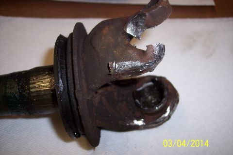 1973 Ford F-250 - Close-up of a heavily rusted driveshaft knuckle joint, showing significant damage to the yoke.
