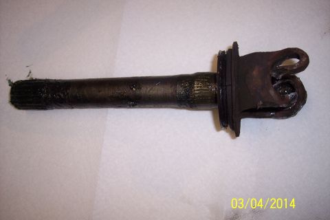 1973 Ford F-250 - Close-up of a driveshaft U-joint and yoke assembly with a greased splined end.