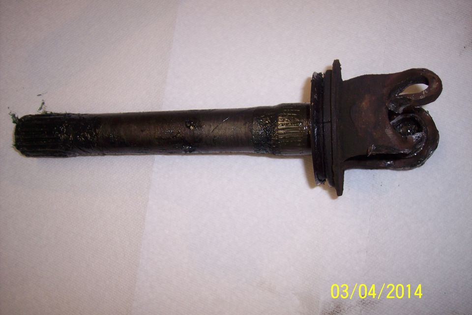 Driveshaft U-joint and yoke assembly, splined end covered in grease