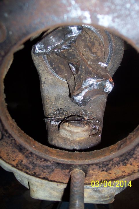 1973 Ford F-250 - This image shows a close-up of a worn universal joint, likely from a vehicle's drivetrain.