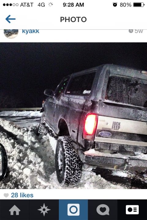 1995 Ford Bronco - This 1995 Ford Bronco is stuck in a snowy environment, a humorous sticker on its tailgate.