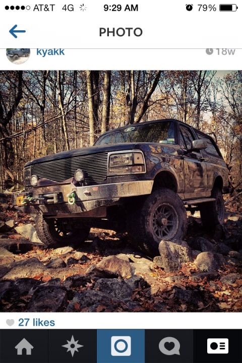 1995 Ford Bronco - This 1995 Ford Bronco is shown off-roading on a rocky trail during autumn.