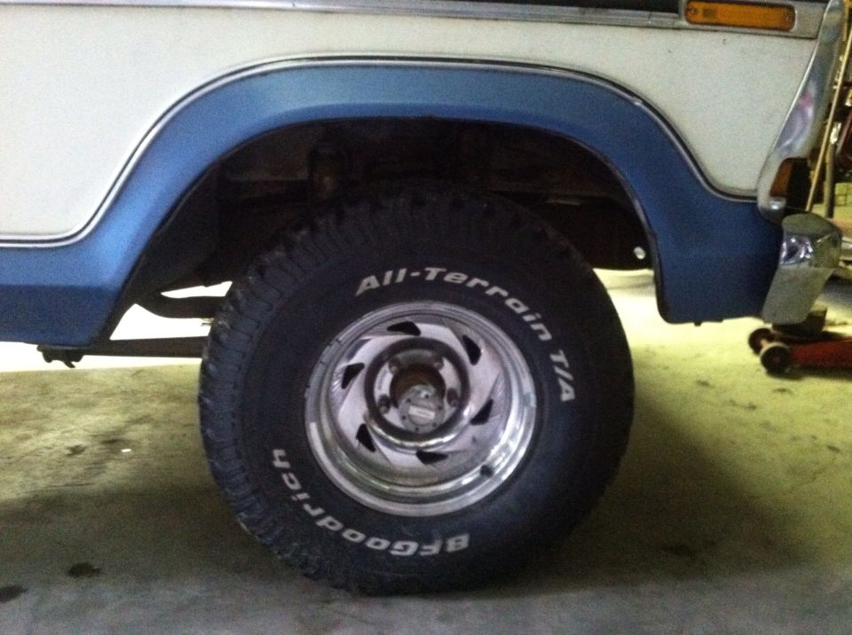 White and blue 1978 Ford Bronco front passenger side wheel well with BFGoodrich All-Terrain T/A tire