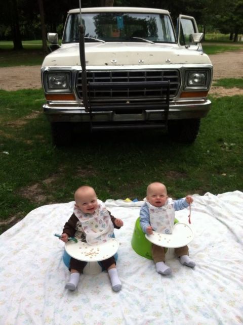 1979 Ford Bronco - 1979 Ford Bronco front view with two babies enjoying a picnic.
