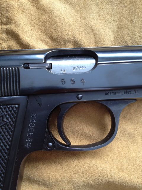 1992 Ford Mustang - A detailed view of a pistol, highlighting its markings and construction.