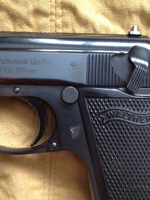 1992 Ford Mustang - Close-up view of a Walther PPK pistol, showing manufacturer markings and caliber information.