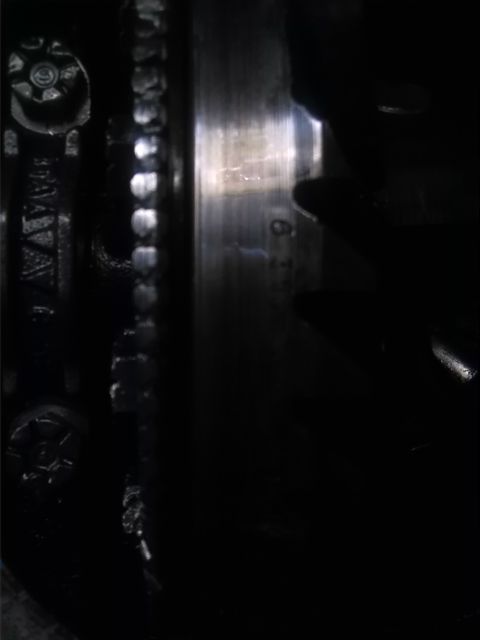 1992 Ford Bronco - A close-up view of internal engine components, showing gears and fasteners.