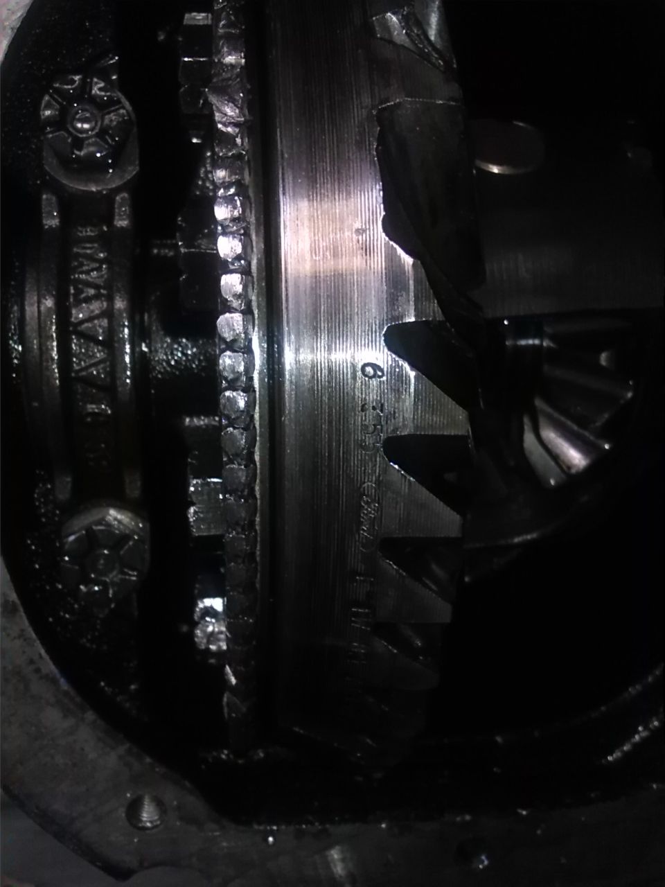 Close-up of differential gears with visible part numbers