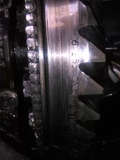 1992 Ford Bronco - A close-up view of an engine component shows stamped serial numbers and manufacturing details.