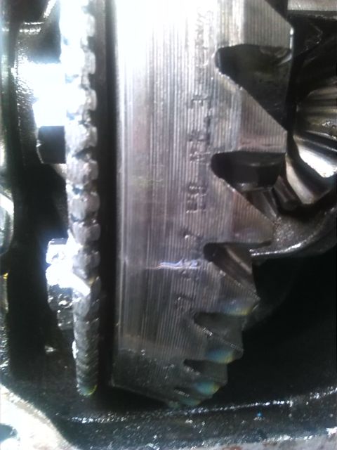 1992 Ford Bronco - Close-up view of internal differential gears, showing etched markings on the metal housing.