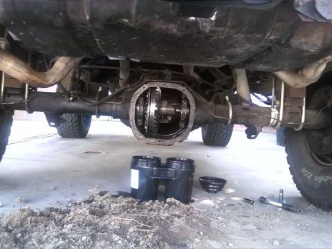 1992 Ford Bronco - The rear differential is exposed, with parts laid out for maintenance or repair.