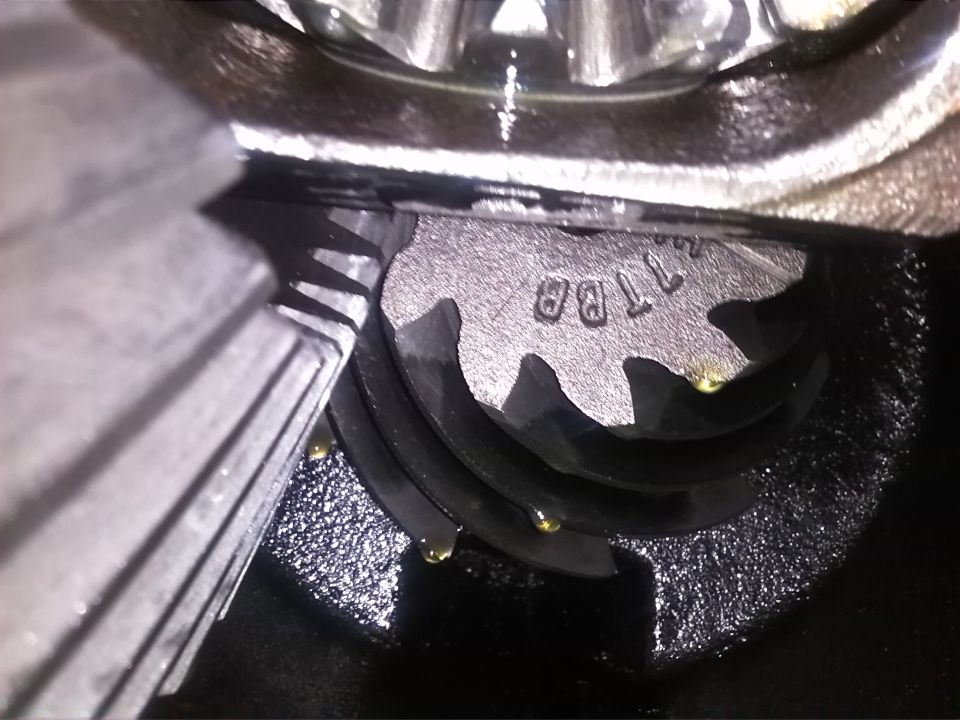 Close-up of differential gears with stamped numbers '11BA'
