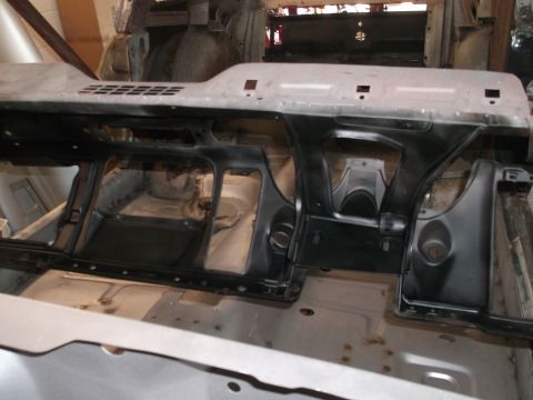 1967 Ford Mustang - Interior of a disassembled vehicle, possibly a 1967 model, with the dashboard removed.