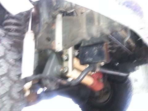 1992 Ford Bronco - Undercarriage view shows suspension system components and associated hardware.
