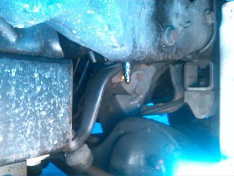 1992 Ford Bronco - Undercarriage view shows suspension parts, potentially from a Ford Bronco.