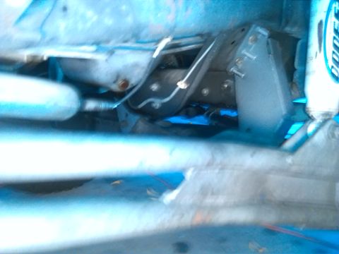 1992 Ford Bronco - This image shows a portion of a vehicle's undercarriage, focusing on mechanical parts and suspension.