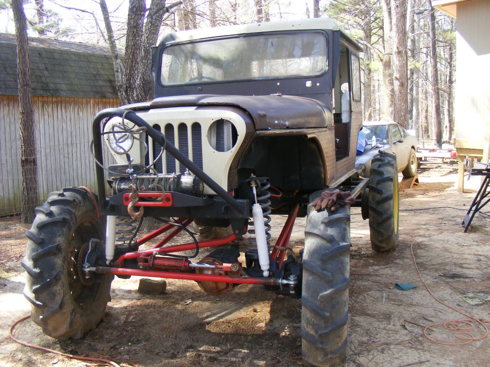 Custom off-road vehicle with large tractor tires and a winch