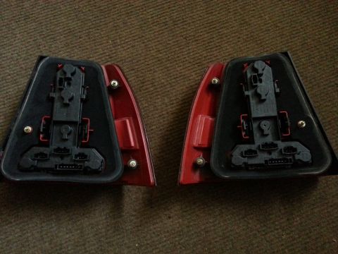 2002 Volkswagen Jetta - Pair of car tail light assemblies shown from the rear, with electrical connectors.