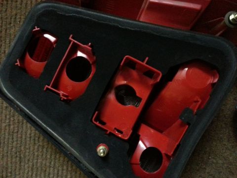 2002 Volkswagen Jetta - This is a red plastic housing for a car taillight assembly, showing the internal structure and bulb sockets.