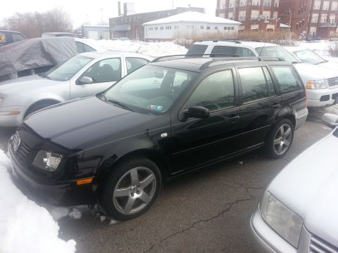 2002 Volkswagen Jetta - A black 2002 Volkswagen Jetta wagon is parked in a lot with snow on the ground.
