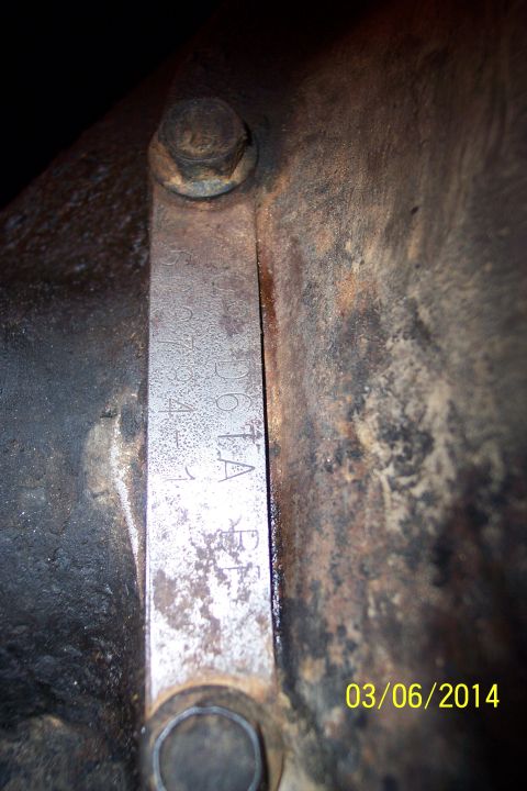 1973 Ford F-250 - Axle identification tag showing stamped markings, likely for part identification.