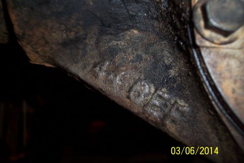 1973 Ford F-250 - A close-up view of a heavily corroded axle casting shows stamped numbers, but no clear year identification.