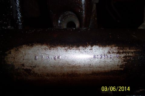 1973 Ford F-250 - A metal component displays stamped identification numbers, possibly for a vehicle part.