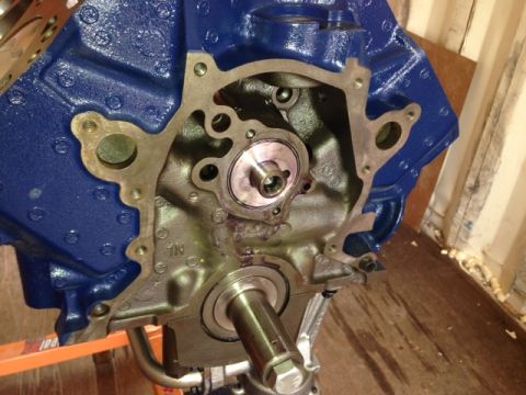 1996 Ford Bronco - Close-up of an engine block with a visible crankshaft and front seal assembly.