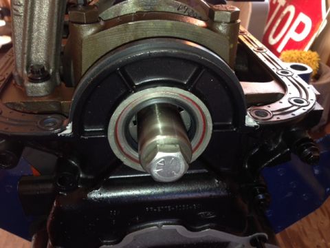 1996 Ford Bronco - Close-up of an engine part, possibly a crankshaft seal, with a hex bolt.