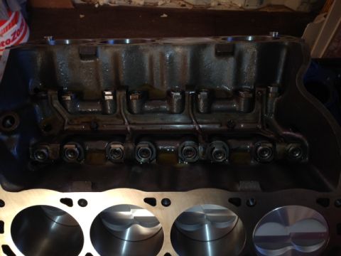 1996 Ford Bronco - Close-up of an engine block with pistons and valve train components visible.