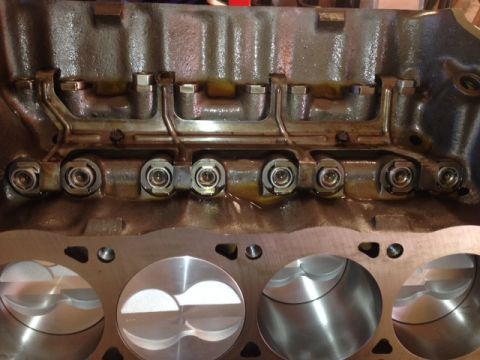1996 Ford Bronco - Close-up view of an engine block, pistons and internal valve train components, with a Supermotors.net watermark.