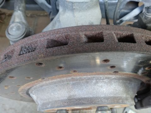 1993 Ford Taurus - This photo shows a heavily corroded brake rotor, indicating significant wear and potential need for replacement.