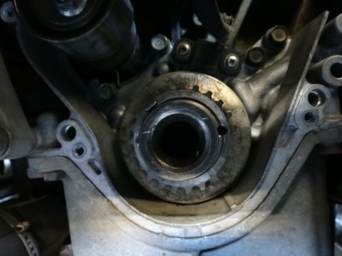1993 Ford Taurus - Close-up view of an engine timing gear, showing its toothed edge and central mounting point.