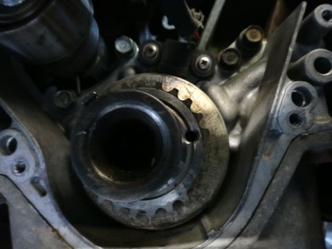1993 Ford Taurus - Engine timing component with a toothed wheel and sensor visible.