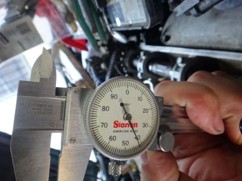 1993 Ford Taurus - Using a dial caliper to measure engine part clearance.