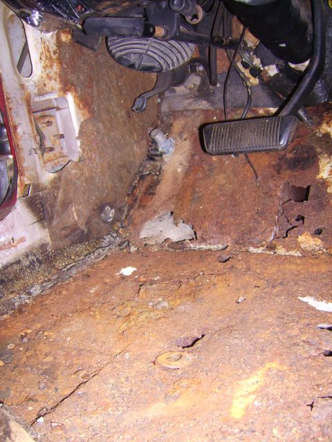 1968 Ford Mustang - The floor pan of this vehicle is severely corroded, with significant rust and holes visible.
