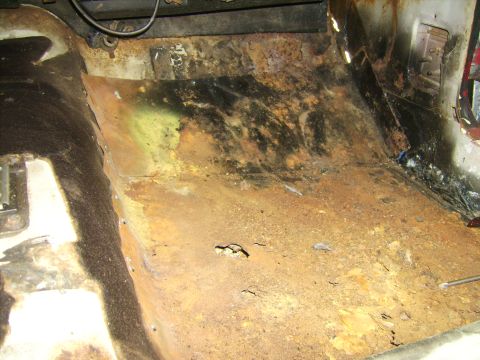 1968 Ford Mustang - Extensive rust damage is visible on the interior floor pan of this 1968 Ford Mustang.