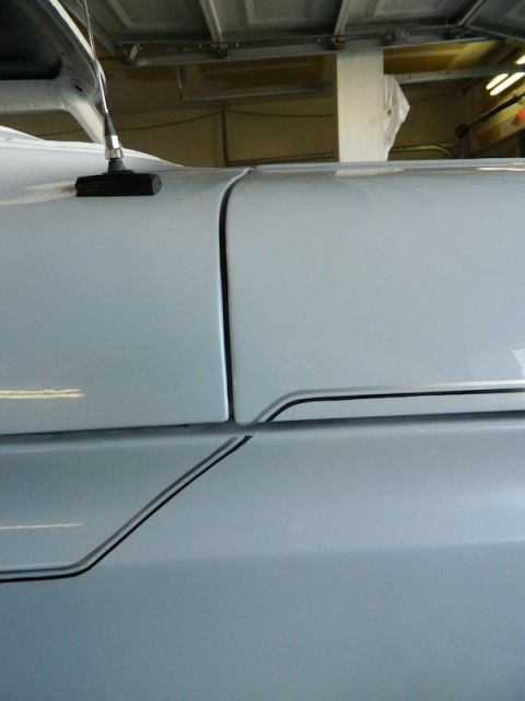 1979 Ford Bronco - Detail shot of a vehicle's bodywork, highlighting the pinstripe design along the side panel.