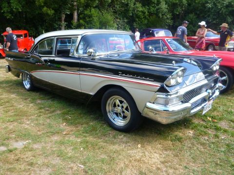 1964 Mercury Monterey - A classic two-tone 1957 Ford Fairlane 500 is displayed outdoors with other vehicles.