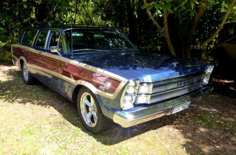 1964 Mercury Monterey - This 1965 Ford station wagon features a distinctive wood grain trim and aftermarket wheels.