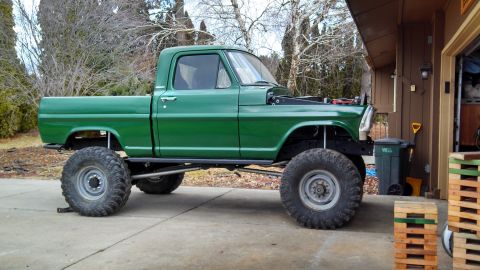 1967 Ford F-250 - This modified 1967 Ford F-250 pickup truck features a lifted suspension and oversized off-road tires.