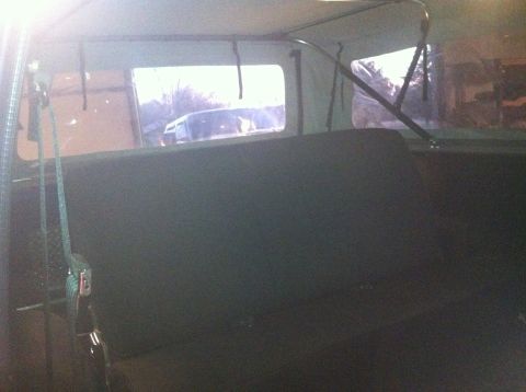 1982 Ford Bronco - View from the rear interior of a vehicle, looking out the back window.