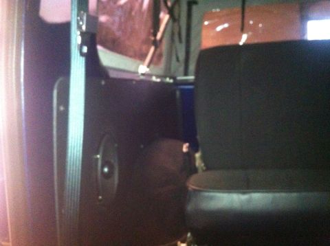 1982 Ford Bronco - Interior shot of a vehicle's door panel and seat.