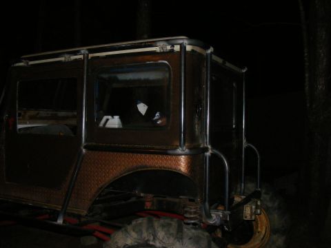 Custom SUV body with diamond plate fenders and roll cage