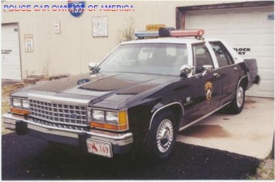 1991 Ford Crown Victoria LTD - 1991 Ford Crown Victoria LTD police car parked in front of a garage.