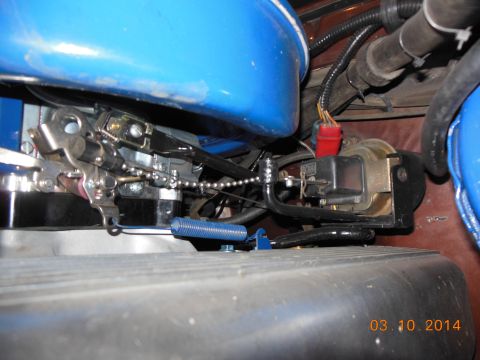 1979 Ford F-150 - Cruise control actuator and carburetor linkage detail, showing a blue spring.