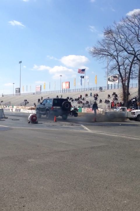 1995 Ford Bronco - This 1995 Ford Bronco is performing a burnout at a drag strip event.