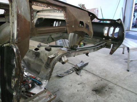 1967 Ford Mustang - This 1967 Ford Mustang is undergoing extensive restoration, with its interior stripped down to the rusted floor pans and dashboard frame.