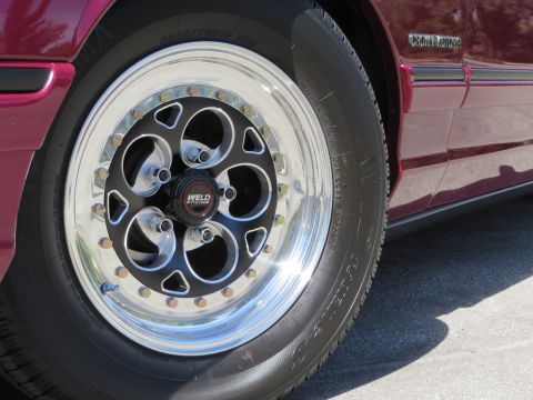 1992 Ford Crown Victoria - 1992 Ford Crown Victoria with Weld Racing wheels, viewed from the side.